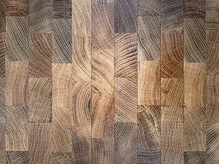 Natural, wooden background of small rectangular brown wooden boards, parquet, close-up. Copy space