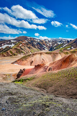 Cover page with colorful Icelandic rainbow volcanic Landmannalaugar mountains at famous Laugavegur hiking trail in Iceland, dramatic summer scenery, with blue sky and sunny day.