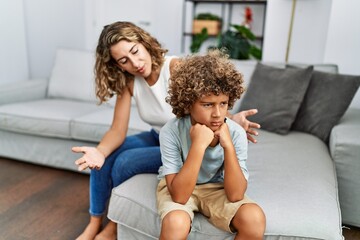 Naklejka na ściany i meble Mother and son arguing at home