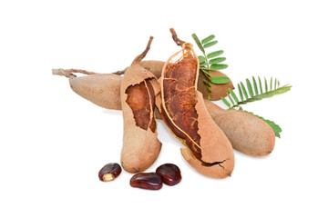 Tamarind fruits with green leaves isolated on white background