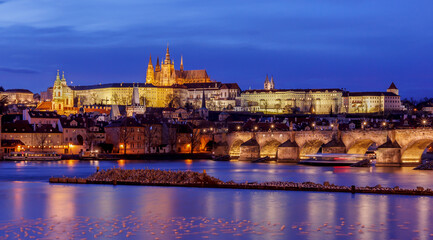 Panorama of Prague Castle,St. Vitus cathedral and Charles Bridge at sunset with dramatic sky. Prague, Czech Republic	
