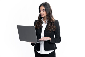 Young beautiful female teacher or happy student isolated on gray studio background. Portrait of college student with laptop. Woman working on laptop, freelance.