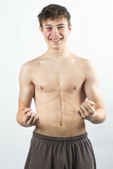 Obraz premium A shirtless 17 year old muscular boy