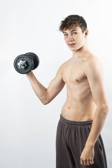 Fototapeta na wymiar A shirtless 17 year old muscular boy