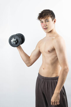 A shirtless 17 year old muscular boy