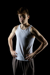 Naklejka premium A 17 Year old wearing a white tank top