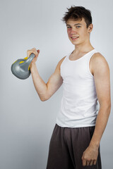Naklejka premium A 17 Year old wearing a white tank top