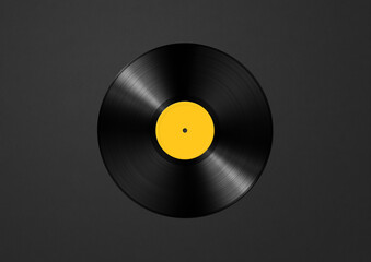 Yellow vinyl record isolated on black background