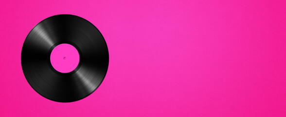 Vinyl record isolated on pink background. Horizontal banner