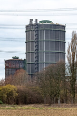 Obraz premium large gasometers in an industrial landscape