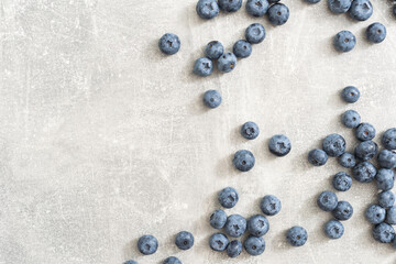Raw Organic Blueberries on a gray background, side view. Copy space.
