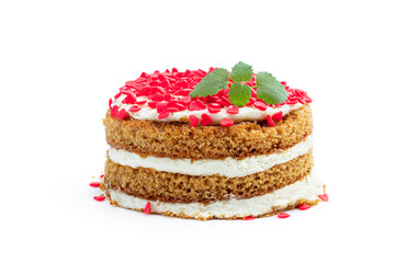 Homemade layered dessert with whipped cream and heart shaped sprinkles isolated on white