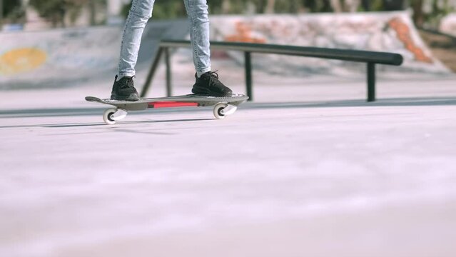 Legs on waveboard close up, Girl riding on casterboard with two wheels, modern street skate sports of teenagers, ripstick for balance ride.