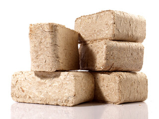 Square Sawdust Briquettes - Compressed Biomass Wood Fire Logs isolated on white Background