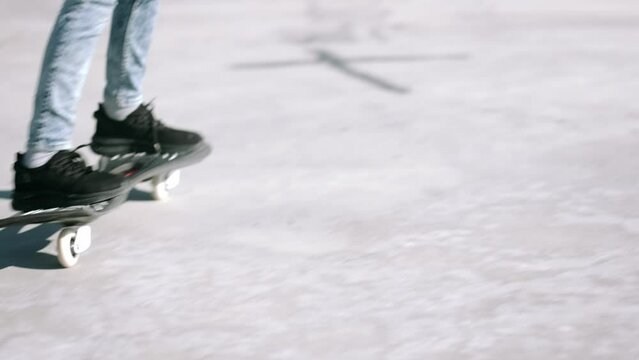 Legs on waveboard close up, Girl riding on casterboard with two wheels, modern street skate sports of teenagers, ripstick for balance ride.