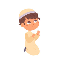 Muslim boy praying, Saudi little child in traditional hat, arab clothes sitting on knees