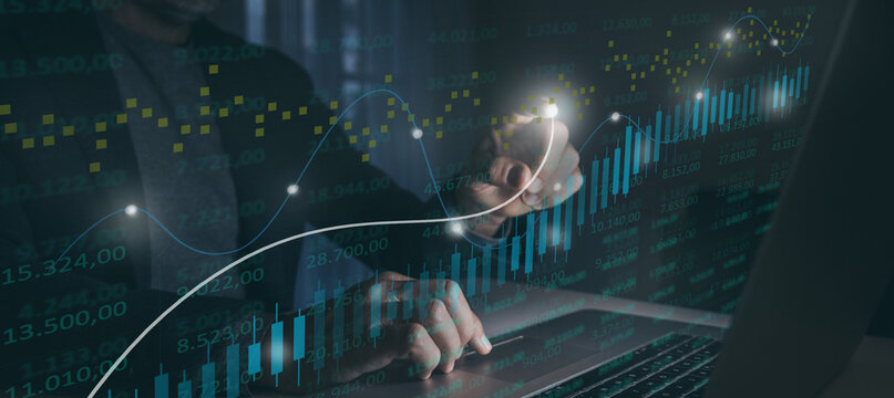 Crypto currency and stock market business investment Trader analyzing graph data on virtual screen