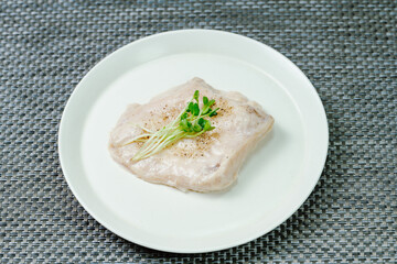 Diet healthy food chicken breast cooked on a white plate on the table