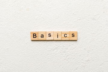 BASICS word written on wood block. BASICS text on table, concept