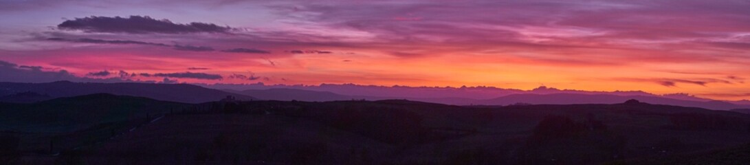 Panoramic view of a sunset in Val d'Orcia, Tuscany