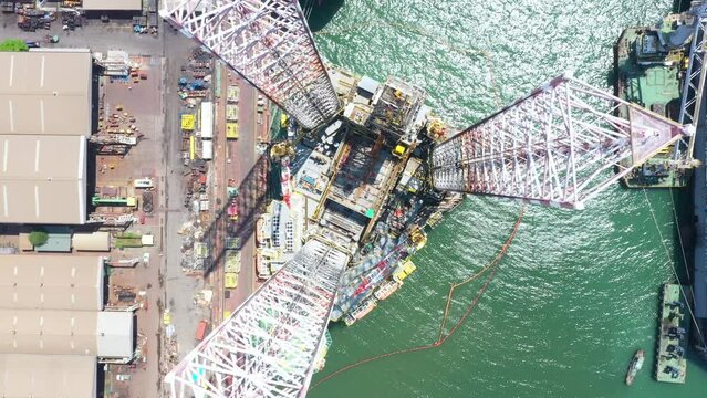 Drilling Rig top view, Aerial view of jack up rig with maintenance plant, 4K Footage.
