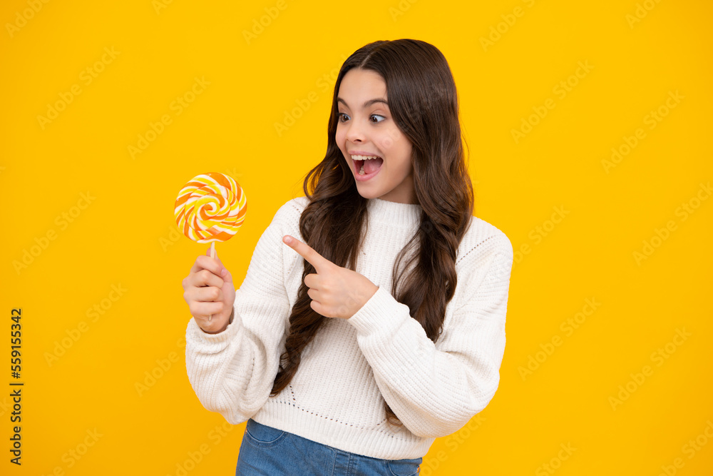 Canvas Prints cool teen child with lollipop over yellow isolated background. sweet childhood life. teen girl with 