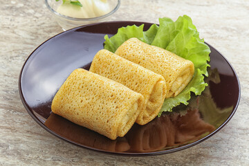 Stuffed pancakes with meat and cream