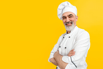 Chef-cooker in a chef's hat and jacket. Senior professional baker man wearing a chef's outfit....