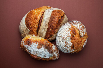 Homemade freshly baked bread. Wood rustic table, board. Rural food cooking. Top view