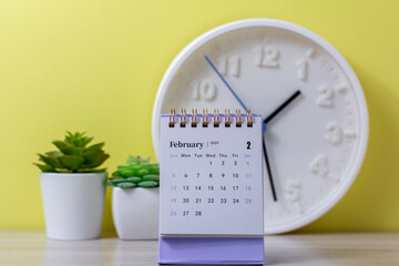 Fototapeta na wymiar February 2023.Desktop calendar on the desktop for planning and management.