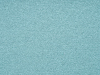 Soft blue felt textue closeup. Handicraft concept, crafts, DIY, do it yourself. Top view, flat lay, layout, place for text. For shops with goods for creativity, to illustrate patchwork master classes.