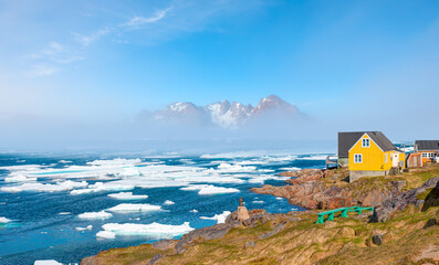 Panoramic view of colorful Kulusuk village in East Greenland - Kulusuk, Greenland - Melting of a...