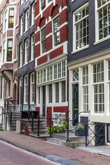 Street lined with typical Amsterdam houses. Amsterdam. Netherland. 