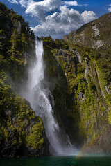 Fototapeta na wymiar Waterfall at Milford Sound New Zealand. South Island. Fjordlands.