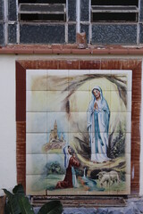 mosaic with drawing of Santa making an appearance to a farmer
