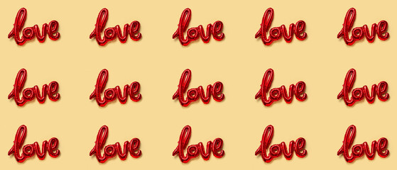 Balloon in shape of word LOVE on beige background. Valentine's Day celebration