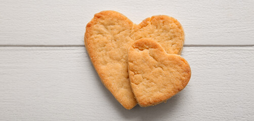 Sweet heart shaped cookies on white wooden background. Valentines Day celebration
