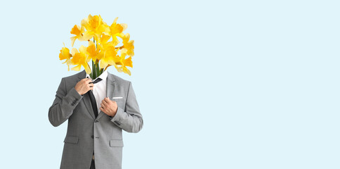 Young businessman with bouquet of flowers instead of his head on light background with space for text
