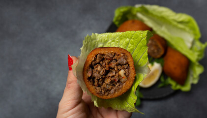 stuffed meatballs
a meal made from bulgur and ground beef, local spicy Tatars (Turkish name; stuffed meatballs)