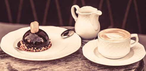 Coffe time. Coffee or coffe cup at cafe in the morning. Loving coffee. Cup of fresh cappuccino. Chocolate cake. Closeup. Tasty chocolate cake