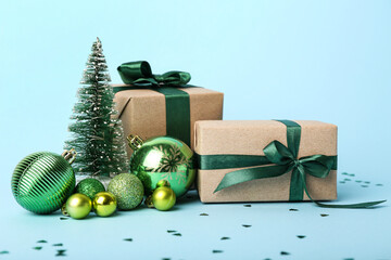 Composition with Christmas gifts and beautiful decorations on color background