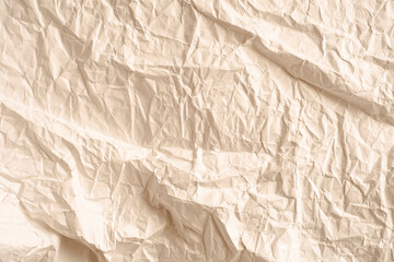 Crumpled paper as a background. Warm color.
