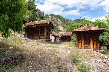 Fototapeta na wymiar Grain warehouses Sinan Degirmeni in Doyran Village. It's estimated that the ancient Lycian region was inspired by the sarcophagi. There are 86 cereal warehouses in the region that can survive. Antalya
