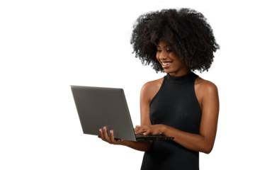 black woman holding a computer while looking and smiling at the computer screen