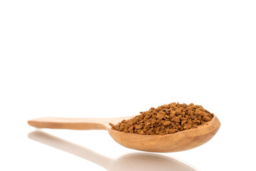 Fragrant instant coffee with wooden spoon, macro, isolated on white background.