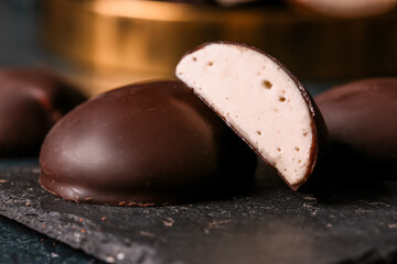 Plate with half of tasty bird's milk candy, closeup