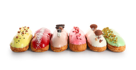 Various glazed eclairs isolated on white background
