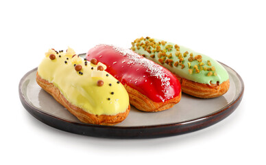 Plate with various glazed eclairs isolated on white background