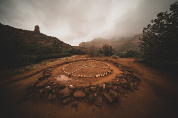 Native American Indian tribal medicine wheel is wet and covered by fog