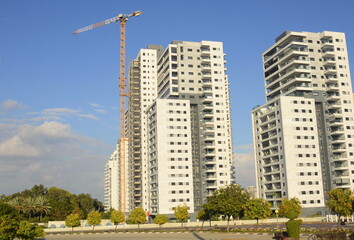Fototapeta premium real estate in israel. Beautiful new buildings, apartment buildings. Modern housing. Concept: investment, loan, mortgage, rent, sale
